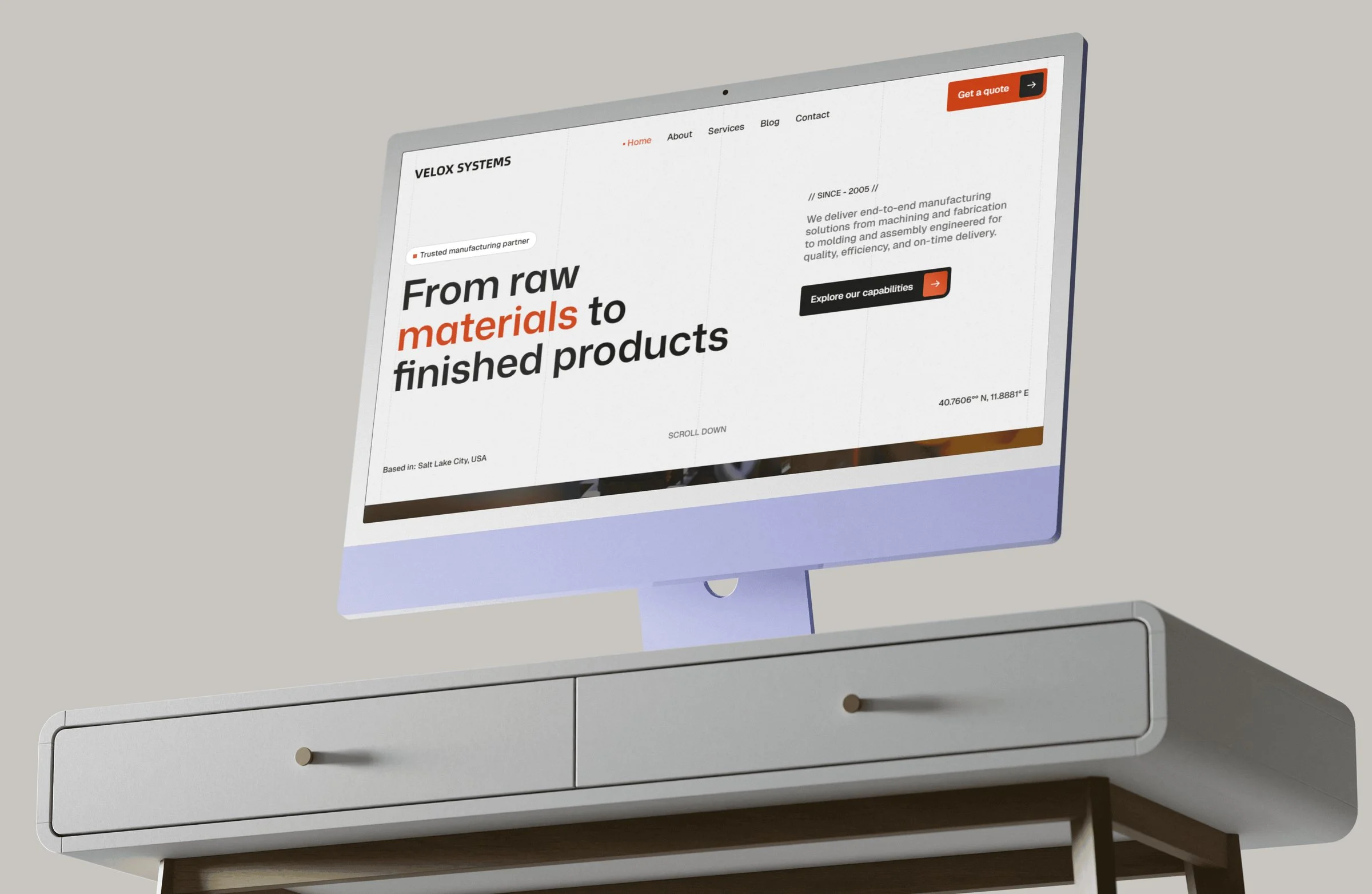 Velox Systems homepage on a desktop monitor with the headline "From raw materials to finished products".